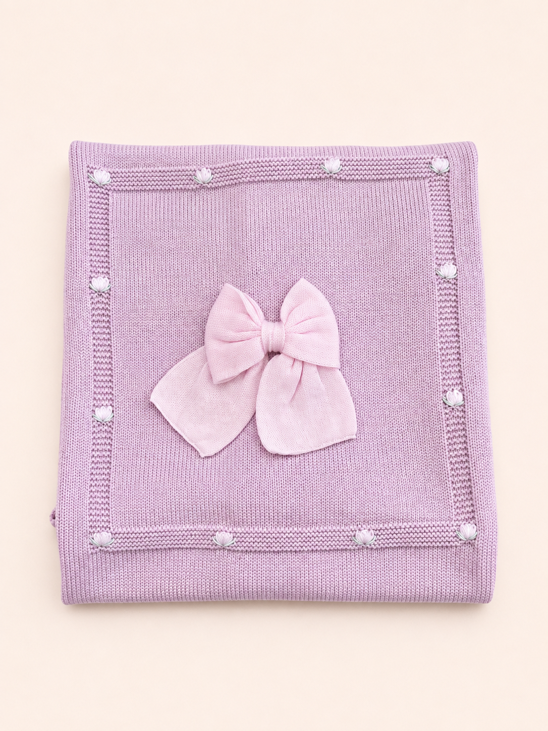 Copertina lilla e fiocco rosa